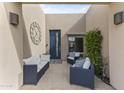 Covered front patio seating with comfortable seating and plants at 7856 E Via Marina --, Scottsdale, AZ 85258