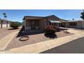 Charming single-story home with a covered patio and easy-to-maintain gravel landscaping at 8103 E Southern Ave # 157, Mesa, AZ 85209