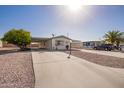Single-story home with carport and desert landscaping at 931 S 91St Pl, Mesa, AZ 85208