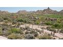 Residential area shows mountains, golf course, and houses at 9804 E Running Deer Trl, Scottsdale, AZ 85262