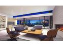 Open living room with modern furniture and fireplace at 9828 E Running Deer Trl, Scottsdale, AZ 85262