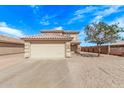 Front exterior of a home with a two-car garage, desert landscaping, and a red tile roof on a sunny day at 11501 N Pablo St, El Mirage, AZ 85335