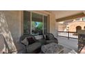 Cozy front porch features comfortable seating, offering a relaxing outdoor space at 13256 N 153Rd Ln, Surprise, AZ 85379