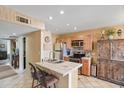 Well-lit kitchen with tiled countertops, stainless steel appliances, and ample cabinet space at 14254 N Boxwood Ln # 158B, Fountain Hills, AZ 85268