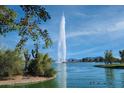 Scenic lake view with a towering fountain as the focal point under a clear blue sky at 14254 N Boxwood Ln # 158B, Fountain Hills, AZ 85268