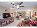 Inviting living area featuring a decorative ceiling fan and access to the adjacent kitchen at 14254 N Boxwood Ln # 158B, Fountain Hills, AZ 85268