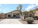 Inviting single-Gathering home displaying a well-maintained front yard with desert landscaping and a clean, modern facade at 14262 N 142Nd Ln, Surprise, AZ 85379