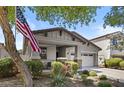 Attractive exterior view with a manicured lawn, small porch, and attached garage at 14793 W Surrey Dr, Surprise, AZ 85379