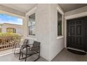 Inviting porch with chairs for relaxing, offering a pleasant outdoor living space at 14793 W Surrey Dr, Surprise, AZ 85379