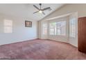Spacious main bedroom with vaulted ceiling and large windows offering great natural light at 1563 E Racine Dr, Casa Grande, AZ 85122