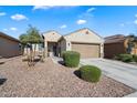 Charming single-story home with desert landscaping, a two-car garage, and inviting curb appeal at 1601 S 215Th Dr, Buckeye, AZ 85326