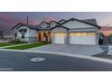Beautiful single-story home with manicured landscaping, gray brick accents, and a spacious three-car garage at 1704 E Melrose St, Mesa, AZ 85203