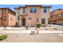 Inviting two-story home featuring desert landscaping and a charming front entrance at 2049 N 77Th Dr, Phoenix, AZ 85035