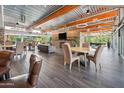 Bright clubhouse lounge with tables, chairs, and stone fireplace offers a comfortable community space at 21817 N 39Th St, Phoenix, AZ 85050