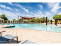 Beautiful community pool with plenty of lounge chairs available for relaxing in the sun at 21817 N 39Th St, Phoenix, AZ 85050