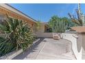 Inviting front porch with desert landscaping, adding charm and character to the home's entrance at 323 E Griswold Rd, Phoenix, AZ 85020