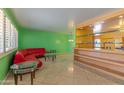 Bright living room with a stylish bar area, offering a perfect blend of comfort and entertainment at 323 E Griswold Rd, Phoenix, AZ 85020