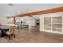 Spacious living room with hardwood floors and white walls open to the kitchen at 3255 E Malapai Dr, Phoenix, AZ 85028