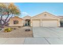 Charming desert home featuring low-maintenance landscaping, a two-car garage, and a welcoming front porch at 4611 E Red Bird Rd, Cave Creek, AZ 85331