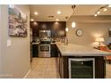 Modern kitchen featuring stainless steel appliances, sleek countertops, and a wine cooler at 5450 E Deer Valley Dr # 1176, Phoenix, AZ 85054