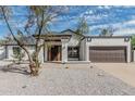 Charming single story home featuring a two-car garage and a well kept xeriscape front yard at 6701 W Monterey Way, Phoenix, AZ 85033