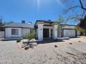 Beautiful single-story home featuring a well-kept yard, an attached garage, and manicured landscaping at 6701 W Monterey Way, Phoenix, AZ 85033