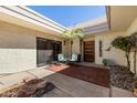 Inviting courtyard with seating area, decorative rocks and mature landscaping for relaxed outdoor living at 7615 E Tucson Rd, Scottsdale, AZ 85258