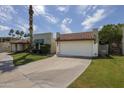 Inviting single-story house featuring a tile roof, an attached garage, and tidy landscaping at 7714 N 17Th Pl, Phoenix, AZ 85020