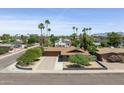 Scenic aerial view of the home showcasing its desert surroundings and mountain views at 8502 E Rose Ln, Scottsdale, AZ 85250
