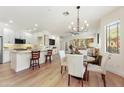 Bright and airy living space featuring stylish furnishings, wood flooring and an open layout to the kitchen at 11500 E Cochise Dr # 1015, Scottsdale, AZ 85259