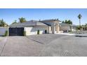 Beautifully landscaped single-story home featuring a gray tile roof, modern design, and inviting entryway at 13365 N 74Th St, Scottsdale, AZ 85260