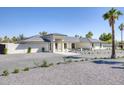 Striking one-story home with manicured desert landscaping and a driveway, ideal for sophisticated living at 13365 N 74Th St, Scottsdale, AZ 85260