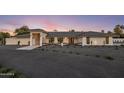 Elegant single-story home with desert landscaping, offering a modern and inviting curb appeal at 13365 N 74Th St, Scottsdale, AZ 85260