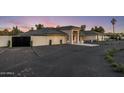 Beautiful single-story home featuring elegant architecture and manicured landscaping and a circular driveway at 13365 N 74Th St, Scottsdale, AZ 85260