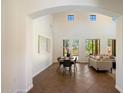 Bright dining room with high ceilings and large windows, leading to the living room at 20750 N 87Th St # 1024, Scottsdale, AZ 85255