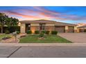 Charming home featuring well-maintained landscaping and a three-car garage at 21912 E Desert Hills Dr, Queen Creek, AZ 85142