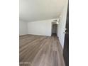 Bright living room featuring hardwood floors and neutral paint at 2544 N 52Nd Ave, Phoenix, AZ 85035