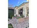 Inviting front porch with brick steps and an elegant door at 2707 E James St, Gilbert, AZ 85296