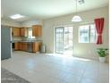 Eat-in kitchen with stainless steel appliances, modern fixtures, and sliding door to outdoor at 2826 E Tracy Ln # 3, Phoenix, AZ 85032