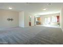 Open concept living room and kitchen with modern finishes, stainless steel appliances and natural light at 2826 E Tracy Ln # 3, Phoenix, AZ 85032