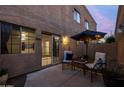 Private patio with comfortable seating and elegant lighting perfect for relaxing outdoors at 2826 E Tracy Ln # 3, Phoenix, AZ 85032