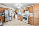 Functional kitchen with appliances and wood cabinets at 3840 W Abraham Ln, Glendale, AZ 85308