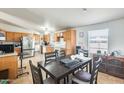 Open-concept kitchen and dining area filled with natural light at 3840 W Abraham Ln, Glendale, AZ 85308