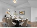 Bright dining room featuring a marble top table, decor, modern lighting and neutral-toned walls at 4200 N Miller Rd # 325, Scottsdale, AZ 85251