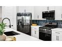 Kitchen features white countertops and cabinets and stainless steel appliances at 4543 S Nebula --, Mesa, AZ 85212