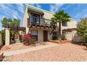 Charming two-story home with a balcony, small yard and desert landscaping at 4818 E Hazel Dr # 1, Phoenix, AZ 85044