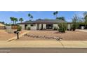 Charming single-story home with desert landscaping, offering curb appeal and a low-maintenance yard at 5827 E Larkspur Dr, Scottsdale, AZ 85254