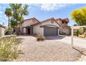 Single-Gathering home boasting tidy front yard and an attached two-car garage at 6837 S Roosevelt St, Tempe, AZ 85283