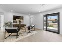 Bright living room with sleek furniture, neutral tones, a stylish rug, and an inviting atmosphere at 8430 E Fairmount Ave, Scottsdale, AZ 85251