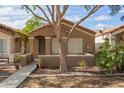Inviting single-story house with a low wall across the front yard and desert landscaping at 875 S Nebraska St # 69, Chandler, AZ 85225
